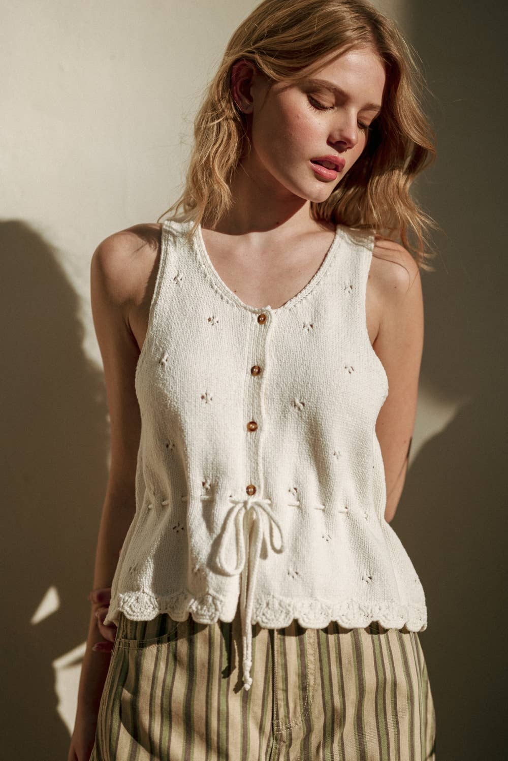 SLEEVELESS BUTTON KNIT TOP